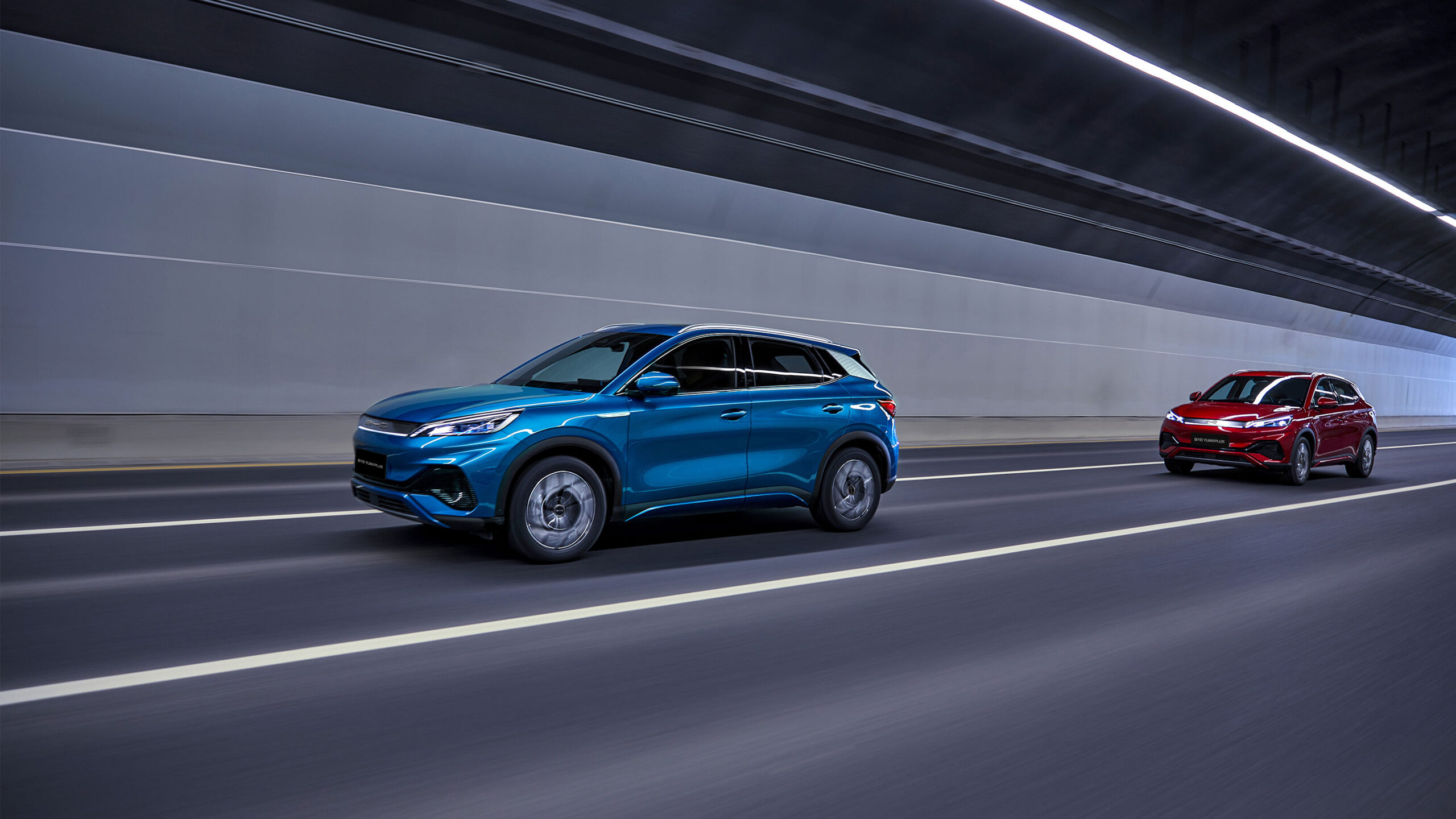 BYD Yuan Plus electric SUV in metallic silver, compact modern design with sleek headlights and aerodynamic lines.