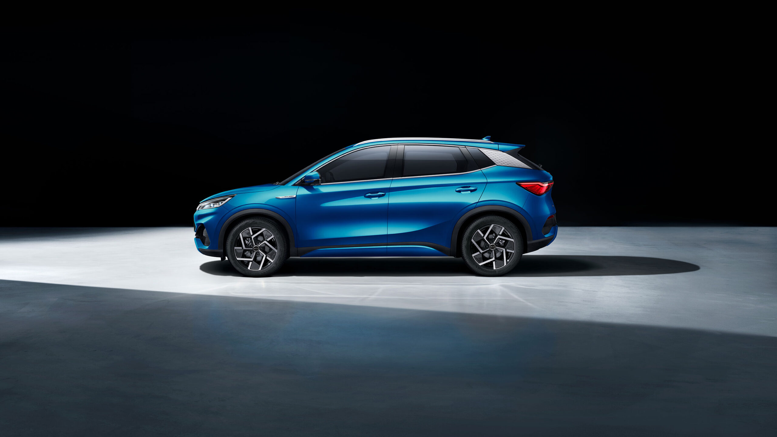 BYD Yuan Plus electric SUV in metallic silver, compact modern design with sleek headlights and aerodynamic lines.